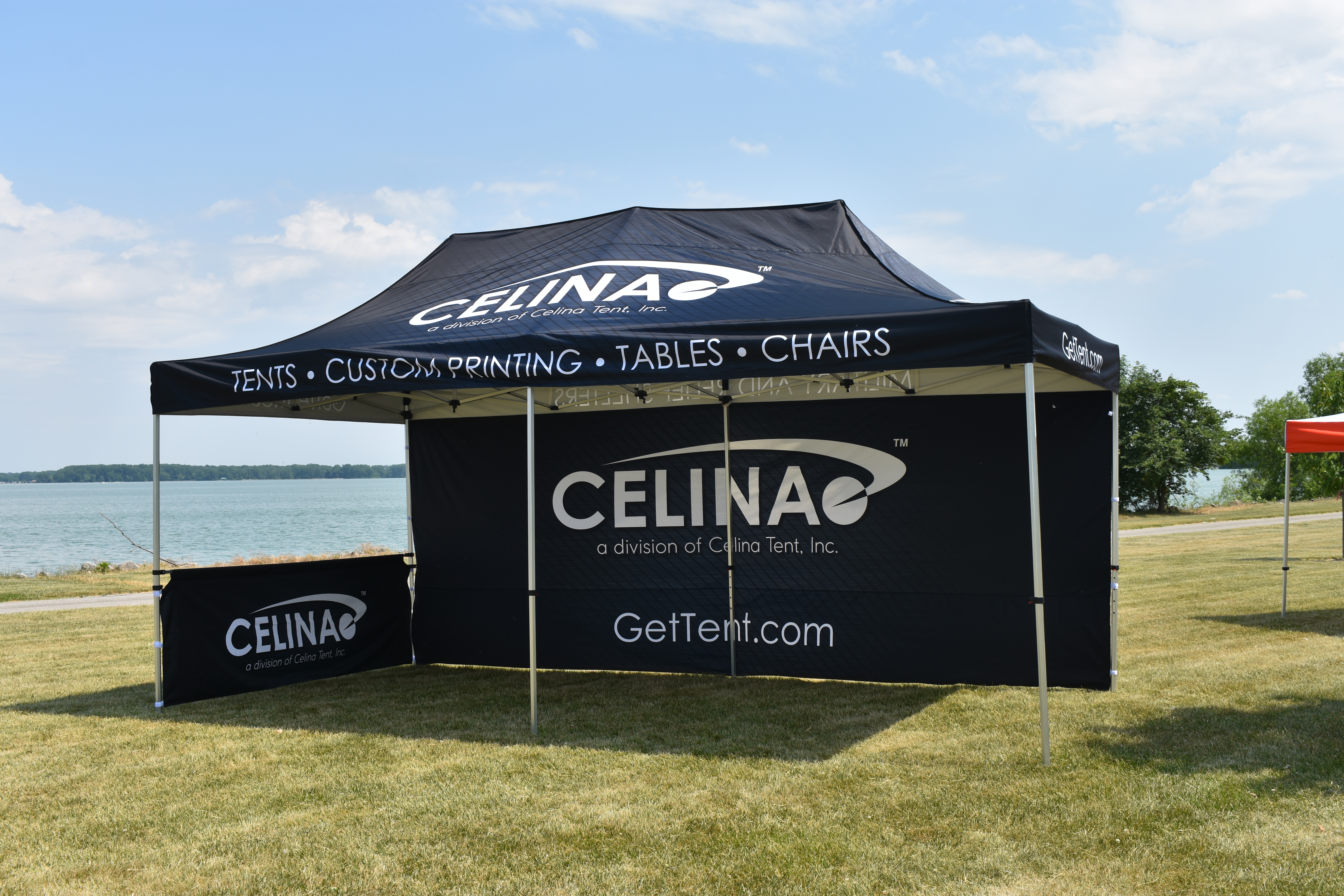 CELINA branded pop up canopy in outdoor setting
