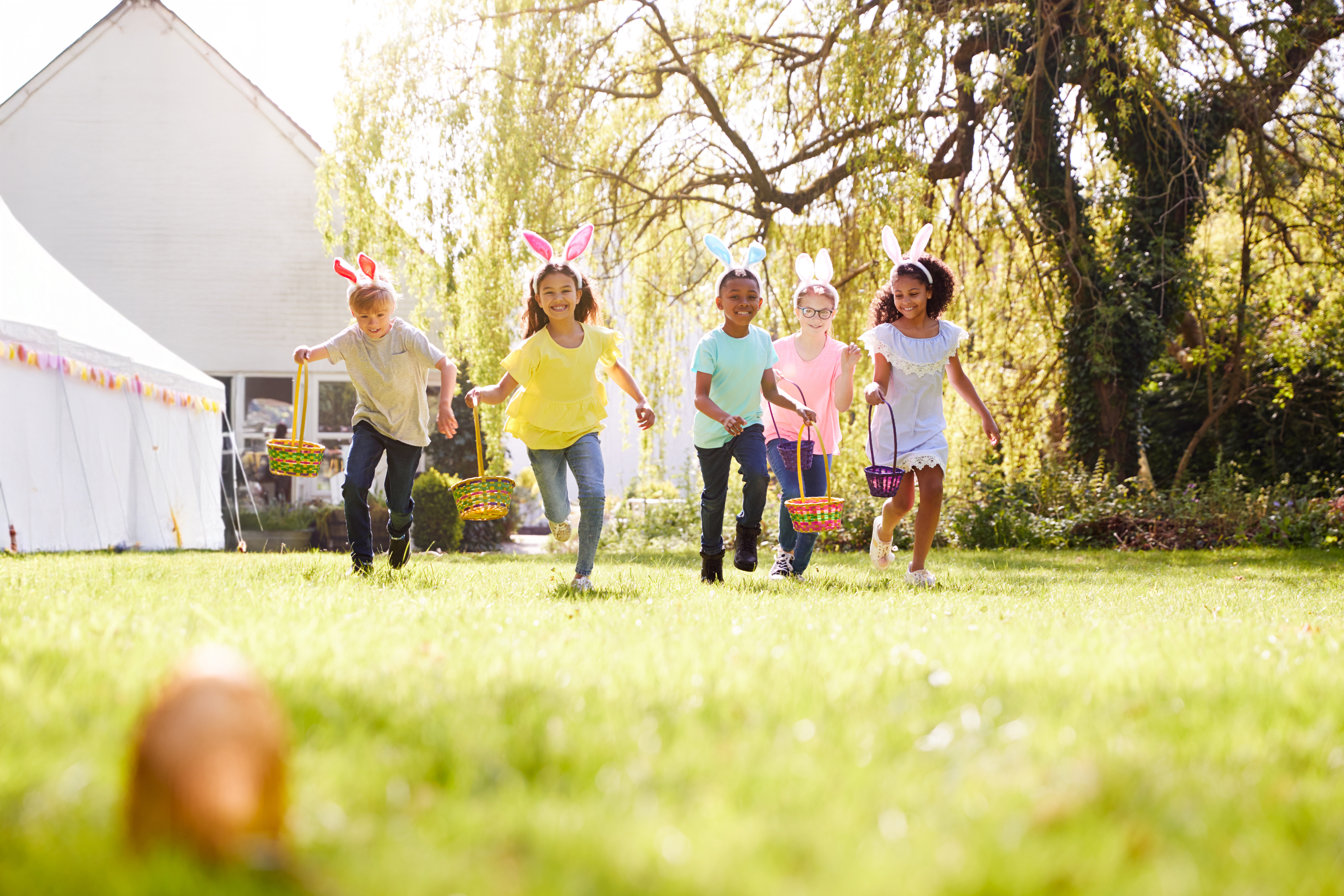 Outdoor Easter celebration under party tent