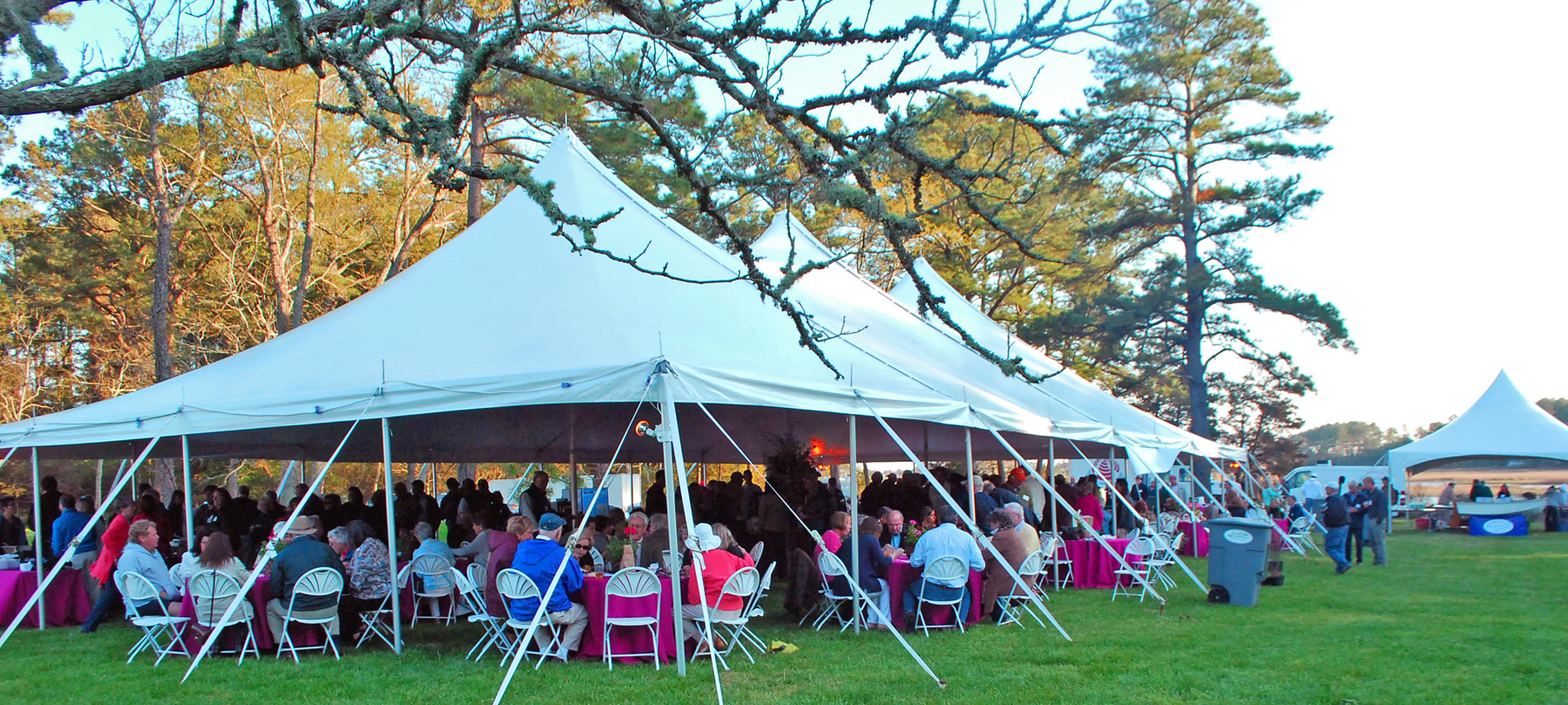 Vinyl tent setup in a sunny outdoor event