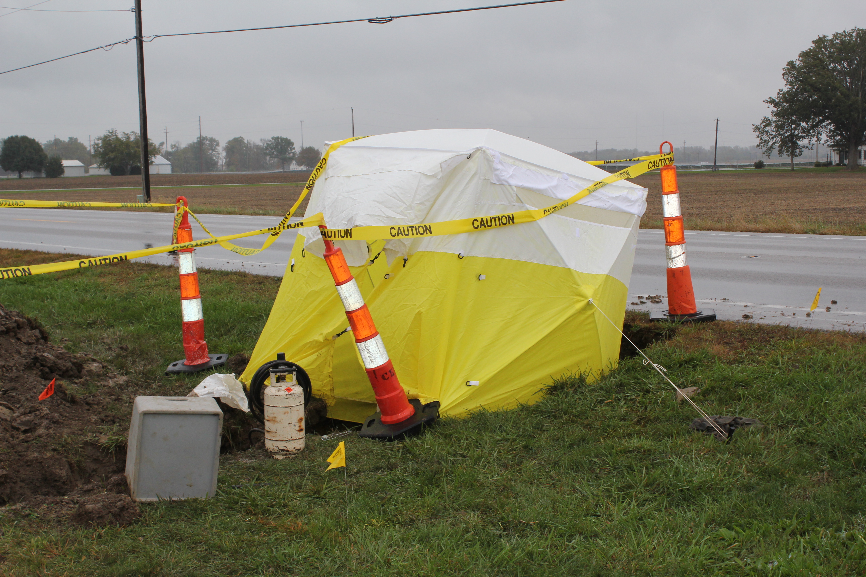 Athens utility pop up shelter in use by road workers during rain storm Athens utility pop up shelter in use by road workers during rain storm
