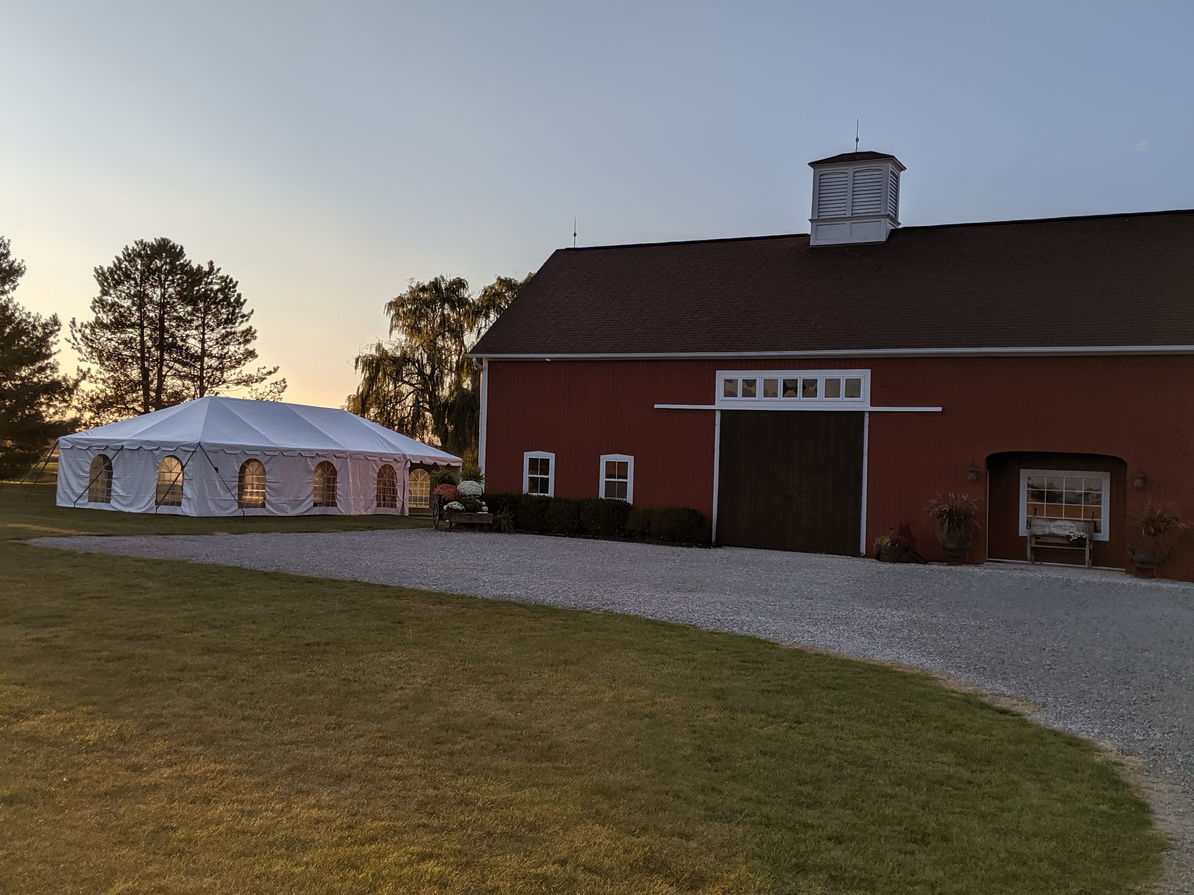 Premium Party Tent Setup next to barn for outdoor event