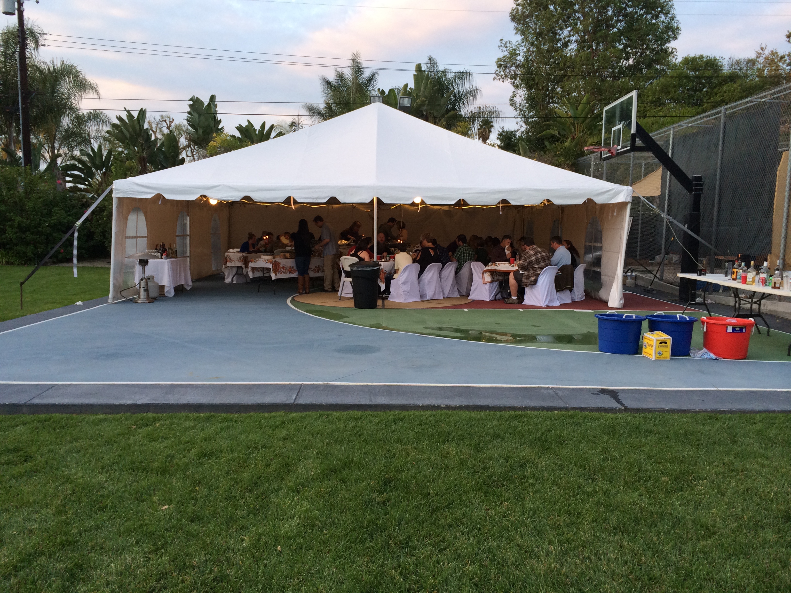 Family enjoying outdoor Easter event with party tent