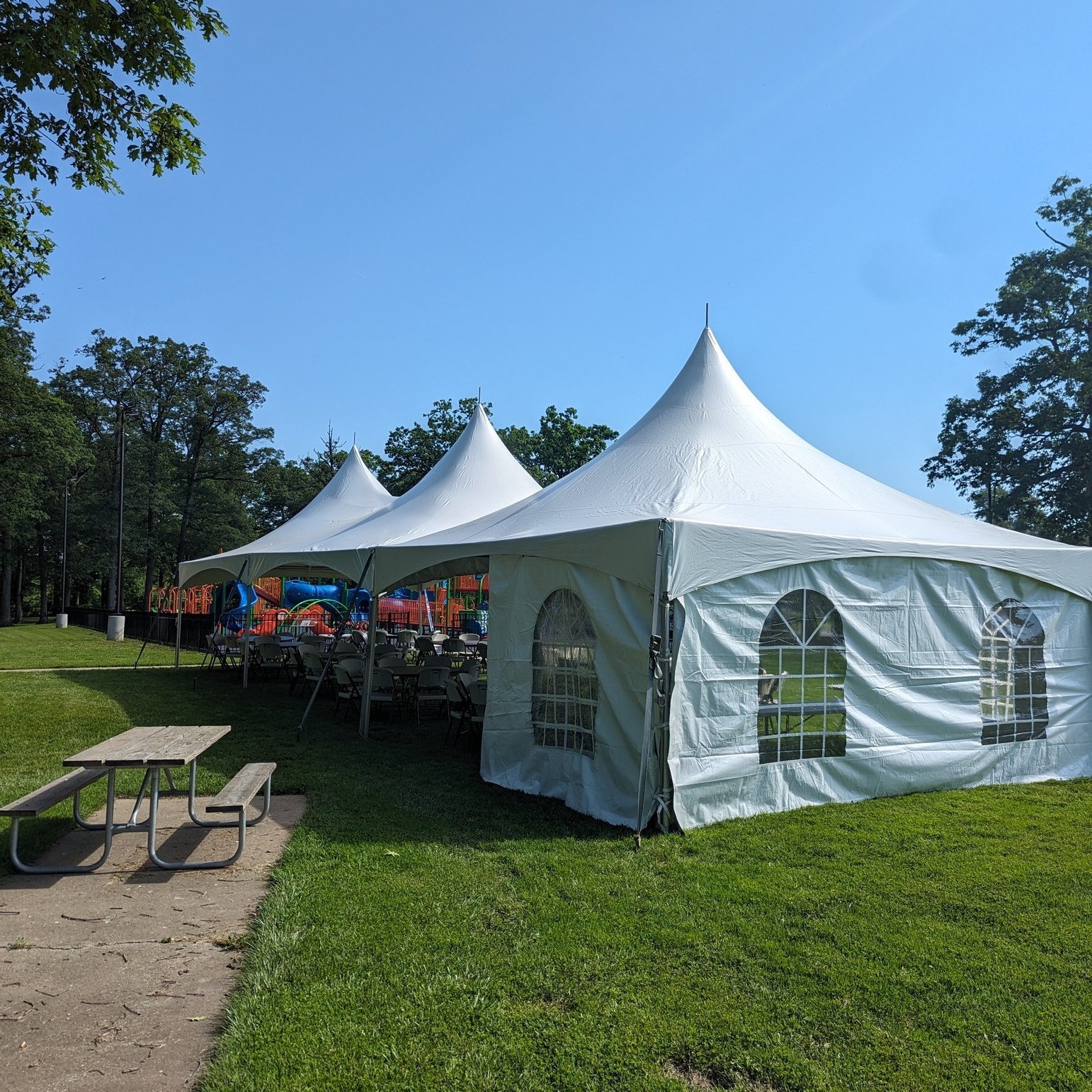 Window sidewalls on a Pinnacle high peak cross cable frame tent Window sidewalls on a Pinnacle high peak cross cable frame tent