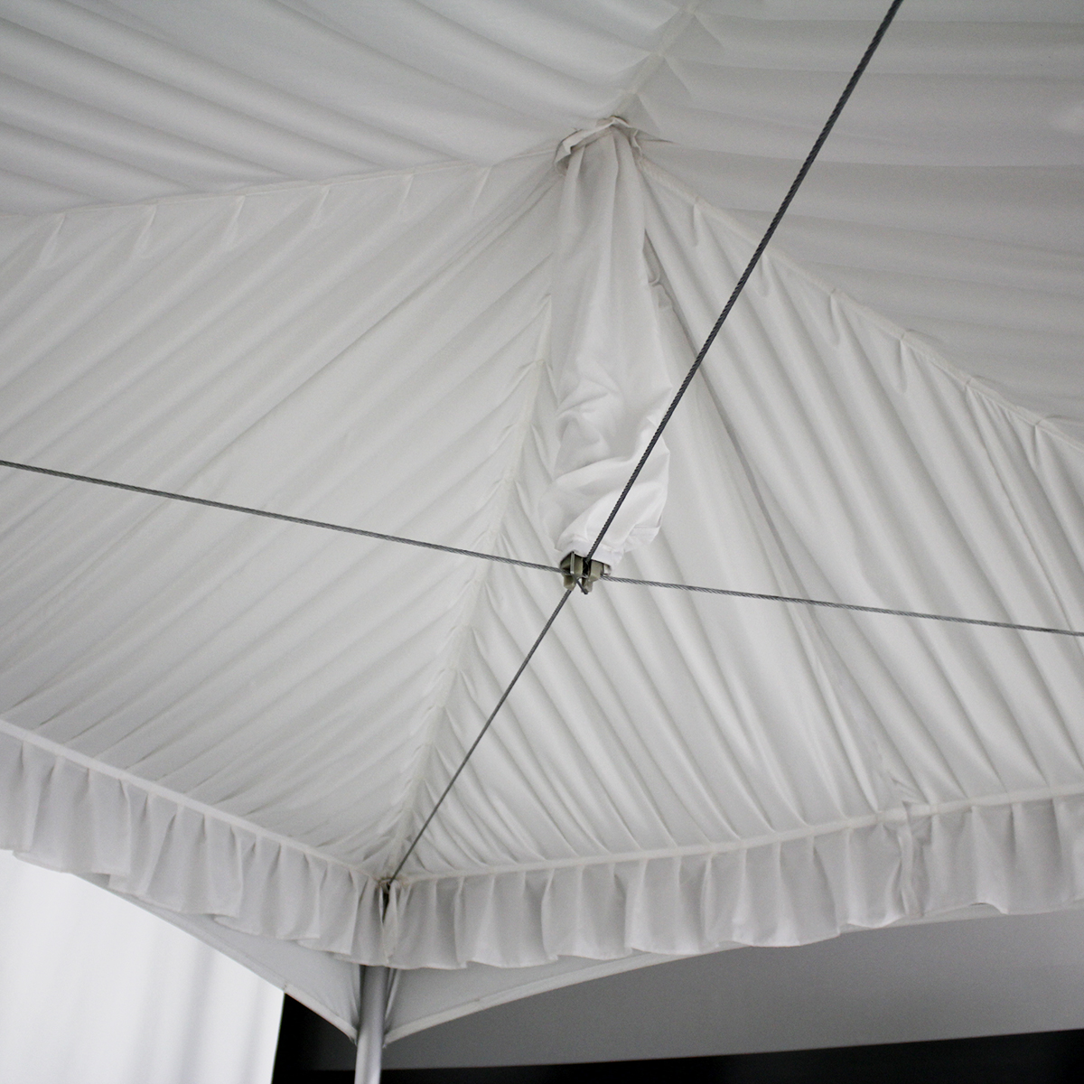 Wedding event under a tent with white tent liner installed